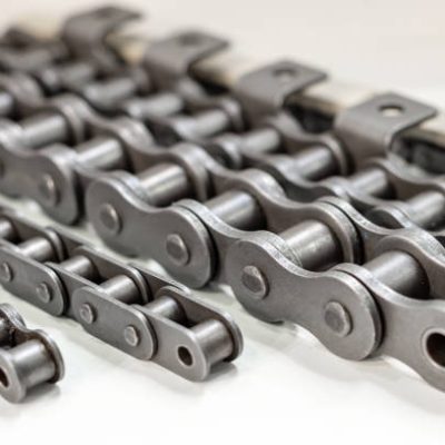 Mental chain for mechanical chain transfer. Photo with shallow depth of field. Abstract industrial background.